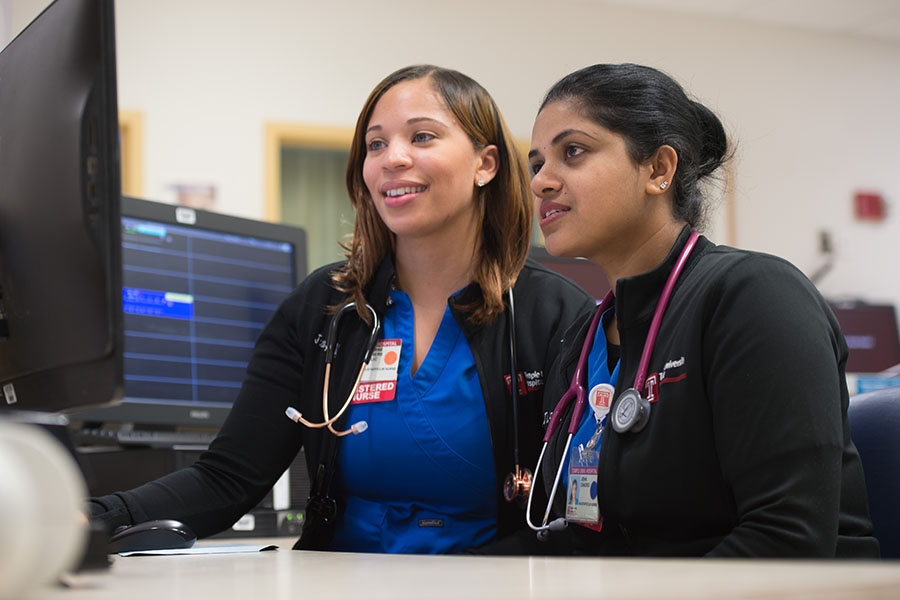 Temple nurses on computer