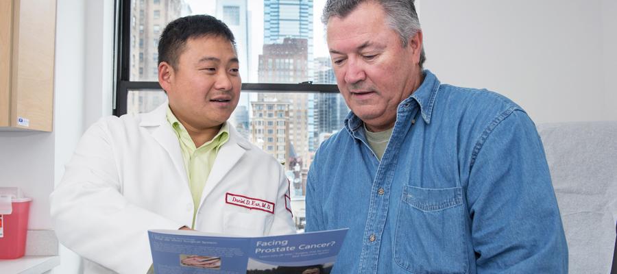 Urologist discusses ultrasound with patient